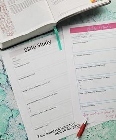 a bible study book and pen on a table