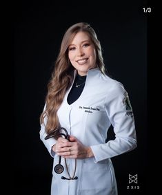 a woman in white lab coat holding a stethoscope