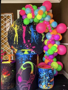 some balloons and tin cans on a table