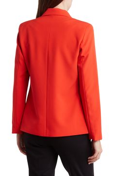 Bring a pop of color to your wardrobe with a classic one-button blazer fashioned with notched lapels for polished style. 26" length One-button closure Notched lapels Lined 96% polyester, 4% spandex Dry clean or hand wash, line dry Imported Model stats: 5'10" height, 32" bust, 25" waist, 36" hip. Model is wearing size 4. Red Fall Office Wear Blazer, Red Blazer For Office Wear In Fall, Tailored Red Career Blazer, Tailored Red Blazer For Career, Red Tailored Blazer For Career, Classic Red Blazer For Office Wear, Spring Business Casual Red Blazer, Chic Red Blazer With Suit Collar, Chic Red Blazer For Business Casual