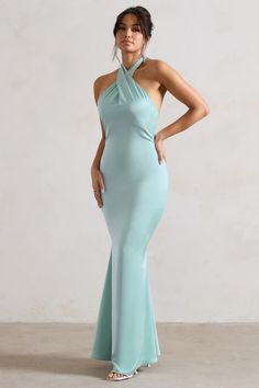 Exude confidence at your next event in this show-stopping maxi. Unbeatable. Arriving in a soft mint green hue of a premium satin. this backless piece features a cross over halter-neck thats finished with wide self-tie straps for the perfect custom fit. For an elegant bridesmaid attire. try styling yours with our Just A Fling court shoes. Features - Premium satin- Cross over halter neckline- Open back- Invisible zip closure - Fishtail skirt- Maxi length Sizing & Fit Model is 5'8 and wears UK size 8 / US size 4 Product Information Designed exclusively by Club L London Partially lined with no stretch Premium satin in Mint (100% Polyester) 155cm total length SKU: CL129991003 Fitted Cross Back Maxi Dress For Party, Floor-length Maxi Dress With Crisscross Straps For Evening, Fitted Formal Maxi Dress With Cross Back, Green Halter Neck Maxi Dress For Prom, Elegant Floor-length Maxi Dress With Crisscross Straps, Green Backless Bridesmaid Maxi Dress, Green Backless Maxi Dress For Bridesmaid, Green Floor-length Halter Dress For Party, Green Backless Maxi Dress For Formal Occasions