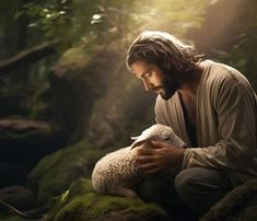 a man kneeling down holding a sheep in the forest with sunlight streaming through trees behind him