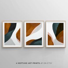 three abstract paintings hanging on the wall in an empty room with text that reads,'neptune art prints / on etsy '