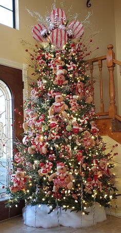 a christmas tree decorated with candy canes and ornaments