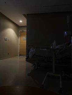 an empty hospital room at night with the lights on