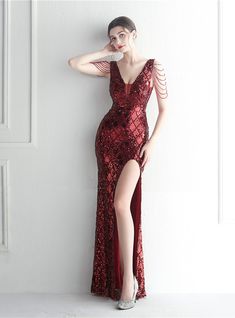 Refined and ravishing, this burgundy mermaid gown dazzles with diamond sequins. The deep V-neck meets a bodice adorned with beaded cap sleeves for a harmonious balance of sparkle and sophistication. A sensual high slit elevates the floor-length skirt, adding a touch of daring to the gown. The zipper-up back ensures a comfortable and flawless fit, allowing you to own the room. Burgundy Mermaid Prom Dress, Beading Party, Beaded Party Dress, Sequin Halter, Short Party Dress, Sequin Party Dress, Floor Length Skirt, Mermaid Gown, Gold Sequins