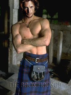 a man in kilts is posing with his arms crossed