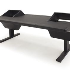 an office desk with two black trays on it's legs and one is empty