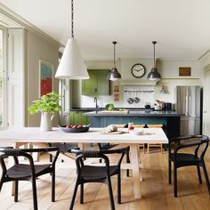 the kitchen is clean and ready to be used as a dining room or living room