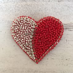 This Love red&silver heart brooch is an excellent addition to the basic wardrobe. Like all basic things, it's combined with many items, whether it's a sweater, jacket, coat, dress, hat, cap or even a bag. Materials: - Czech beads; - crystals; - metal clasp; - chamois-leather Measurements: This item is around 55mm in diameter and its weight is 7 gr. The photograph is real, but it cannot convey the beauty of the decoration. By placing an order, you will receive this very brooch. If you have any additional questions - don't hesitate to contact me. Head back to my shop here  https://www.etsy.com/shop/Bulavochka Red Brooch, Felt Beads, Mexican Crafts, Heart Pin, Heart Crafts, Heart Brooch, Gift Love, Crystal Brooch, Valentine's Gift