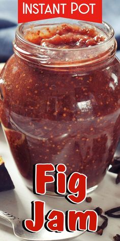 a jar filled with jam sitting on top of a table