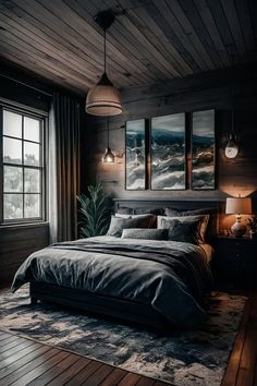 a large bed sitting in a bedroom on top of a wooden floor next to two windows