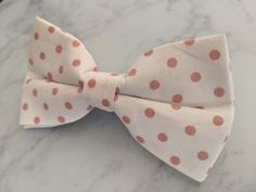 Upgrade your wardrobe in style with this stunning white polka dot bow tie. Perfect gift for him, this unique adjustable bow tie will elevate your style for any occasion including weddings, birthdays and anniversaries. Comes pre-tied. White Adjustable Bow Tie Back, Adjustable White Bow Tie Back, Adjustable White Bow Tie With Decorative Bow, Adjustable White Bow Tie, White Adjustable Standard Bow Tie, Adjustable White Satin Bow Tie, Classic White Adjustable Bow Tie, Dapper White Adjustable Bow Tie, Dapper Adjustable White Bow Tie