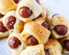 a pile of hot dogs wrapped in bread