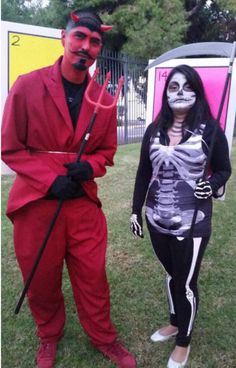 two people dressed up in costumes for halloween