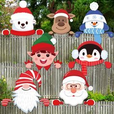 christmas gnomes and snowmen are on the fence