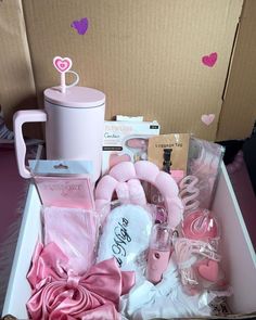 a pink box filled with lots of items