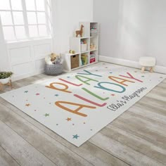 a child's playroom with toys and rugs on the floor that says welcome home