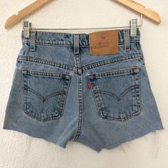 "Size 25 Vintage Levis 550 Cutoff Shorts Jeans High Waisted Distressed Light Wash Denim Shorts Mom Girlfriend Jeans Boyfriends Jeans Cutoffs Short Jeans Made In Mexico Waist 25\" Brand: LEVIS 550  Size on tag: 3 Jr. S Fits like 25\" waist, 11.5\" rise, 23 thighs, 36.5\" hips, 2\" inseam,! Fits a size 25, but check your measurements and compares the measurement with your garment. (see full measurement below) Recommended waist size: 25\" Material :  Cotton 100% Made In Mexico NOT YOUR SIZE? LOOK O Fitted High Waist Faded Bottoms, 90s Washed Bottoms For Spring, 90s Style Washed Bottoms For Spring, Vintage Jeans With Built-in Shorts For Spring, 90s Style Faded Bottoms For Spring, Vintage Summer Shorts With Belt Loops, Vintage Belt Loop Shorts For Summer, Retro Washed Mid-rise Bottoms, Fitted Cutoff Jean Shorts With Belt Loops