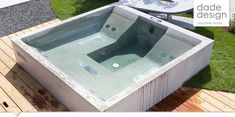 a hot tub sitting on top of a wooden deck