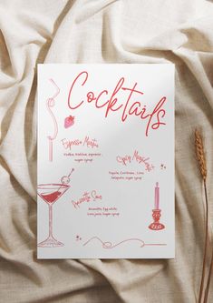 the menu for cocktails is displayed on a bed sheet