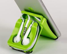 an ipad and headphones in a green case with earbuds attached to it