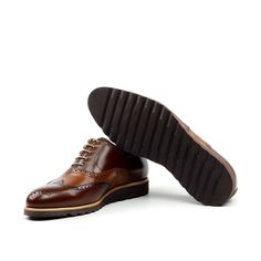 Also known as a wingtip, the Full Brogue is easily identifiable as one of the most classic pairs of men's dress shoes on the market. Featuring a brogue pattern along the sides as well as the toe cap, every man needs a Full Brogue in his shoe closet. Sole units (different available) are Blake stitched to uppers. Upper Materials: Chestnut Brown Box Calf Lining: Caramel Brown Calf Leather Sole: Brown Heeled Rubber Sole Last: Zurigo - Rounded Toe for Traditional English Look YOUR Package Includes Le Shoe Cleaning, Jodhpur Boots, Wood Shoe, Wood Shoes, Men's Dress Shoes, Wingtip Oxford, Brown Box, Traditional English, Leather Box