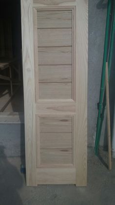 an unfinished wooden door in the process of being built