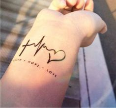 a person's arm with a heartbeat tattoo on it and the word hope written in cursive writing