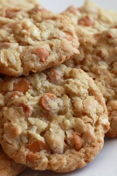 a white plate topped with cookies on top of a wooden table