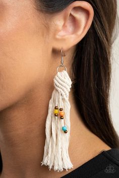 Beach Bash  Multi Earring  
   Dainty wooden and colorful beads are knotted in place along a knotted white tassel, creating a beach inspired macramé centerpiece. Earring attaches to a standard fishhook fitting.   Sold as one pair of earrings. Cheap Tassel Earrings For Beach In Spring, Cheap Summer Tassel Jewelry, Macrame Earrings Supplies, Cheap Tassel Earrings For Beach And Spring, Multi Earrings, White Tassel Earrings, Beach Bash, Antique Brass Frame, White Tassel