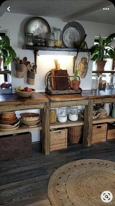 a kitchen with lots of pots and pans on the shelves