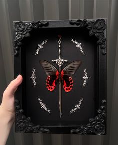 Since the first one I made of these became so popular, I decided to make two more, which are now available on my site! Grab them while you can 😊🖤❤️ . . . #smallbusiness #art #artist #handmade #butterfly #insect #butterflies #insects #entomology #goth #gothic #gothicart #taxidermy #oddity #oddities #curio #curios #curiosities #odditiesandcuriosities #shadowbox #red #black #sword #aesthetic #gothaesthetic #crowcore Bug Pinning Display, Dry Terrarium, Diy Gothic Decor Crafts, Butterfly Taxidermy Art, Faux Taxidermy Diy, Bat Taxidermy, Bug Pinning, Moth Taxidermy, Taxidermy Diy