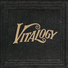 an old book with the word vittalogy written in gold on black paper,