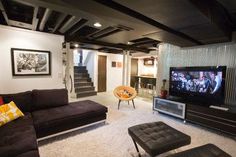 a living room filled with furniture and a flat screen tv