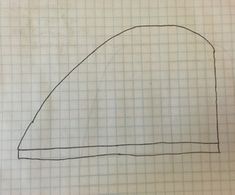 a drawing of a half circle on top of a sheet of paper with graph paper