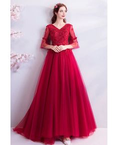 Buy Elegant Burgundy Long Red Tulle Wedding Party Dress With Sleeves at wholesale price online. Free shipping and pro custom service since 2009. Formal Red Tulle Ball Gown, Red Long Sleeve Ball Gown For Banquet, Long Sleeve Tulle Ball Gown With Sweep Train, Red Tulle Ball Gown For Formal Occasions, Red Tulle Ball Gown For Formal Events, Red Tulle Ball Gown For Banquet, Burgundy Tulle Wedding Gown, Wedding Burgundy Tulle Gown, Burgundy Evening Dress For Wedding And Prom Season