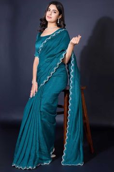 Elevate your elegance with this Designer Khadi Shimmer Saree, a perfect blend of traditional charm and modern allure. Crafted from luxurious Khadi Shimmer fabric, this saree features exquisite border work that gracefully frames the drape, adding a touch of sophistication to every pleat. The matching blouse, also in Khadi Shimmer, complements the saree for a seamless, radiant look. Slight color variations may occur due to digital imaging. Accessories shown are for styling purposes only and not in Shimmer Fabric