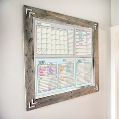 a kitchen wall with a calendar hanging on it