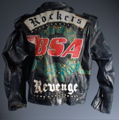 a leather jacket with the words bsa on it and an image of a dragon