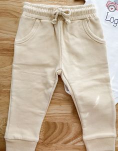 THESE PANTS ARE THE PERFECT MATCH FOR OUR BEIGE SWEATSHIRT. MADE OF THE SAME MATERIAL AND SAME COLOR. Made of 95% organic cotton & 5% spandex. These pants are super soft, have pockets & an elastic waistline with drawstring. Cotton Joggers With Tapered Leg And Pull-on Style, Beige Joggers With Elastic Waistband, White Cotton Everyday Joggers, Everyday White Cotton Joggers, Khaki Cotton Drawstring Sweatpants, Cream Cotton Sweatpants With Elastic Waistband, Cream Cotton Joggers For Loungewear, Beige Cotton Joggers For Loungewear, Cream Drawstring Pants For Loungewear