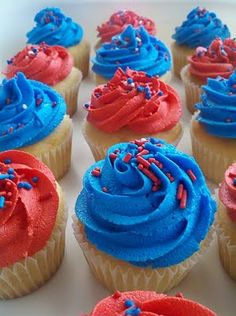 red, white and blue cupcakes with sprinkles are on a plate