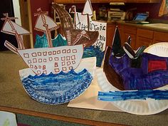 some paper plates with boats on them and other items in the shape of sailboats