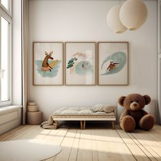 a teddy bear is sitting in front of three paintings on the wall above a bed