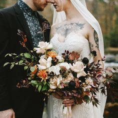 a bride and groom standing next to each other