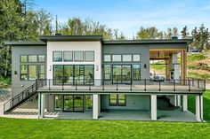 a large house with lots of windows and stairs