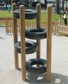 an image of a playground with tires on the bottom and one tire in the middle