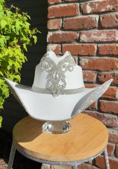 White Tall Crown Hat With Adjustable Fit, White Adjustable Hat With Tall Crown, White Adjustable Tall Crown Hat, Elegant White Hat With Rhinestones, White Party Hat With Rhinestones, White Western Hat With Rhinestones, Western Style Fitted Wedding Hat, Elegant Silver Hats With Bling, Elegant Silver Hat With Bling