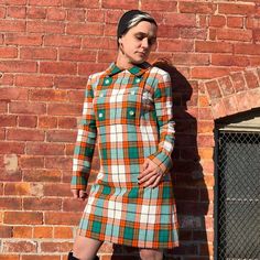 "1960s Plaid Pattern Dress Such a cute plaid dress from the 1960s! Has decorative double breasted buttons on the front and a zipper closure on the back to get in and out of. No size tag - can fit a small to medium.  Measurements: Bust: 37\" Waist: 32\" Hips: 38\" Length: 34\" Shoulder to shoulder: 15\"  Sleeve Length: 22.5\" Armhole opening: 10\" Condition: Good pre-owned condition. Lining is torn at the back. Refer to photo above." Fitted Retro Plaid Dress For Fall, Retro Plaid Winter Dresses, Retro Plaid Dress For Work, Retro Plaid Mini Dress, Vintage Plaid Dress With Button Closure, Plaid Mini Dress, Long Sleeve Velvet Dress, Blue Velvet Dress, Pattern Dress