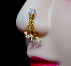 a close up view of a mannequin's head with earrings on it